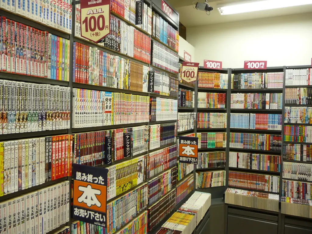 Aisle of a Japanese manga bookstore with long-running series shelved in order